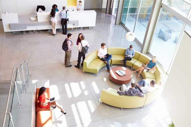 Bradford-international-virtual-school-lobby-entrance-area, Bright lobby of Bradford International Virtual School with students and staff, modern and welcoming