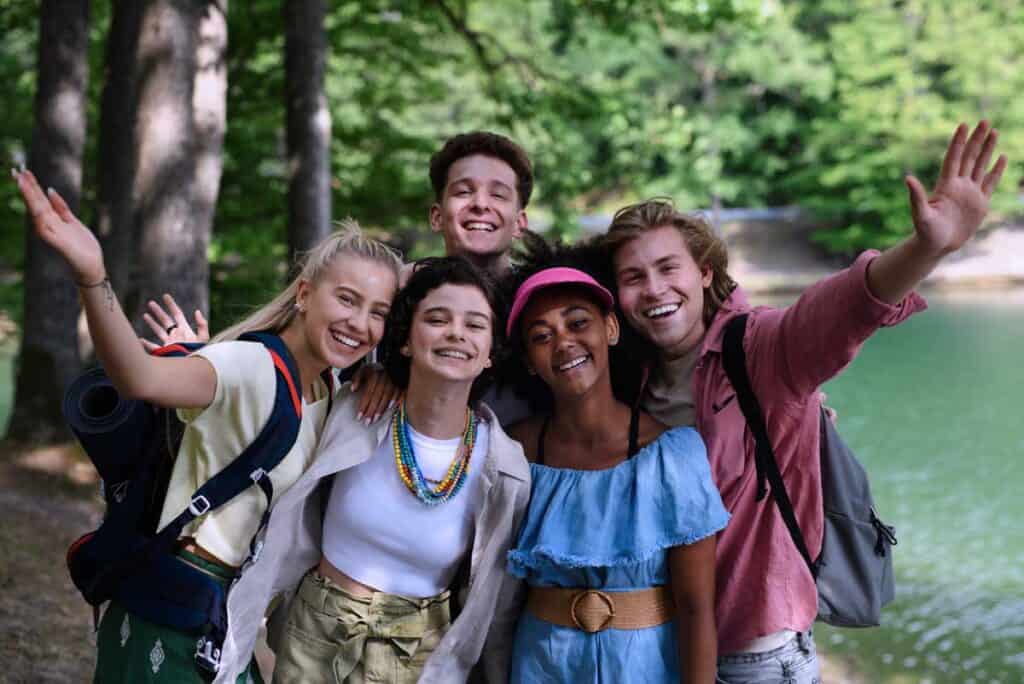 Dynamic group of diverse students exploring nature at Bradford International Virtual School outdoor program.