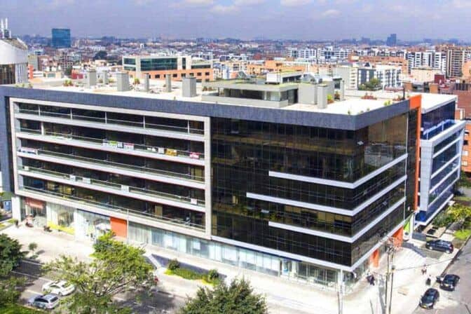 Modern multi-story office building in an urban environment showcasing contemporary architecture.