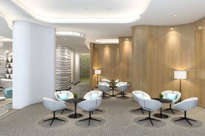 Modern waiting area with white chairs and wooden accents at Bradford International Virtual School.